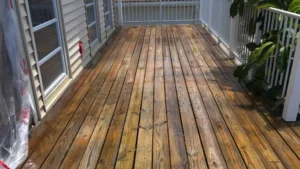 "a wood deck looking bright and clean after a wood deck cleaning service by Spic N Span Pressure Washing and Window Cleaning "